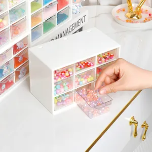 Caja de almacenamiento de escritorio de nueve rejillas con cajones transparentes para abalorios.