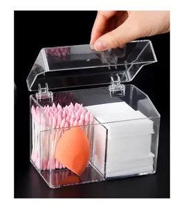 Clear acrylic cosmetic organizer detail, transparent storage box with hinged lid for cotton pads.