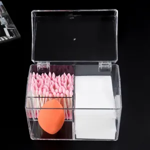 Clear acrylic cosmetic storage box with flip lid, multi-grid organizer for cotton swabs and pads.