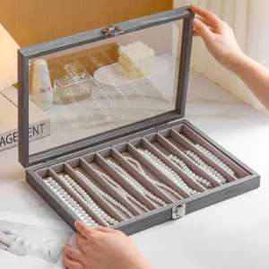 Glacier grey wood jewelry box with glass lid for necklaces, bracelets and earrings display.