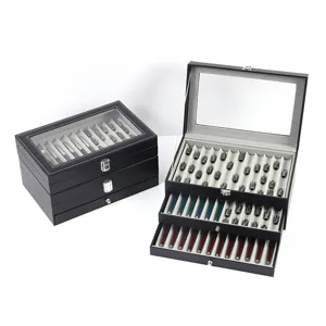 Gran caja de almacenamiento de cuero para bolígrafos y cuentas Dzi con tapa de vidrio y cajones.
