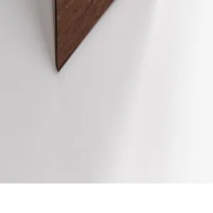 Walnut wood grain jewelry box corner detail, smooth finish and premium material texture.