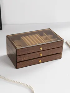 Close-up detail of the multi-layer walnut wood grain jewelry storage box with clear lid.