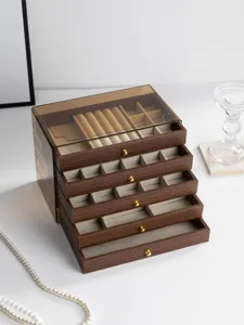 Multi-layer drawer jewelry storage box with walnut wood grain finish and clear top lid.