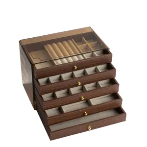 Multi-layer walnut wood jewelry box with clear top, ring slots, and drawer storage organizer.