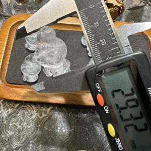 Natural white crystal zodiac snake DIY accessory close-up detail display showing size.