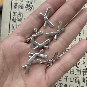 Perline charm fiocco argento per creazione gioielli fai da te, distanziatori metallo per bracciali.