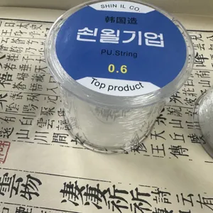 Detail view of transparent elastic string spool, 0.6mm strong cord for craft beading work.