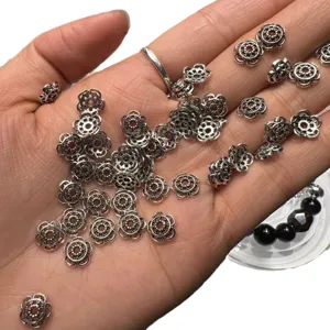 Silver flower bead caps for jewelry making, DIY spacer charms for bracelets and necklaces.