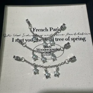 Silver star charm chain jewelry components detail, DIY bracelet accessory craft piece.