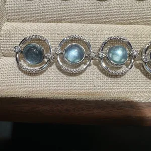 Natural aquamarine gemstone rotating circle design detail shot luxury jewelry gift