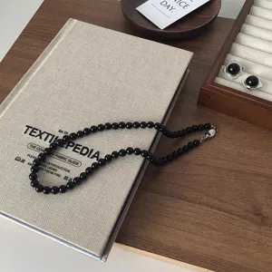 Handmade black agate beaded clavicle necklace, dark gothic style aesthetic detail jewelry.