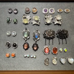 Vintage style metal jewelry components cabochons and gemstone findings for DIY crafts.