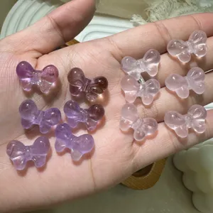 Natural crystal butterfly carvings for DIY jewelry making, pink and purple quartz stones.
