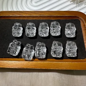 Crystal carved bead close-up, frosted surface detail, clear quartz jewelry DIY part.