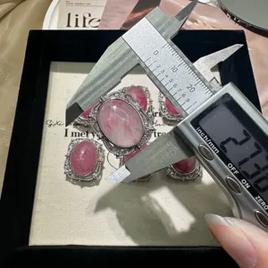 Detailed close-up view of the vintage pink cabochon pendant accessory with size measurement.