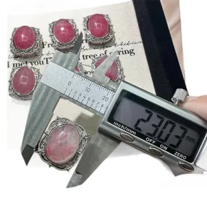 Natural cherry blossom rain stone cabochon pendant accessory with silver frame, 23mm main view.