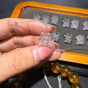 Natural white crystal carved rabbit DIY bead accessory, showing exquisite detail and clear texture.