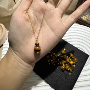 Tiger's eye stone gourd pendant necklace with gold chain and DIY accessories details.