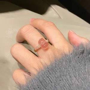 Natural strawberry quartz crystal beaded ring featuring carved charm for daily wear.