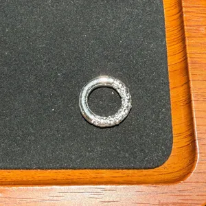 Close-up detail of vintage style alloy spacer bead for DIY bracelet jewelry making.