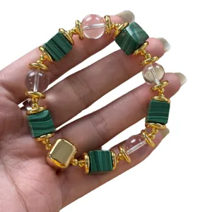 Fashion green malachite and crystal beaded bracelet with 18k gold plated metal components.