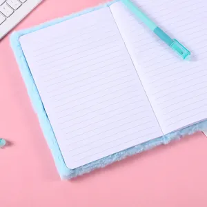 Light blue plush lined notebook with soft cover and matching pen for daily writing journal.