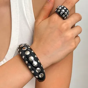 Punk style chunky black resin bracelet and matching ring set with silver tone metal rivet studs.