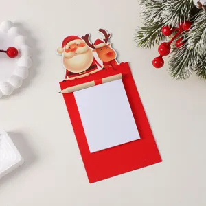 Christmas notepad set with wooden pencil, festive Santa and reindeer design for holiday gifts.