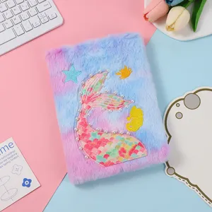 Plush mermaid tail notebook detail showcasing soft fuzzy cover, pearl embroidery, and cute design.