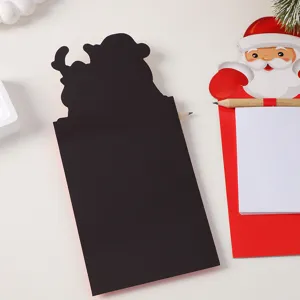 Christmas magnetic notepad detail view showing Santa front design and black magnet back.