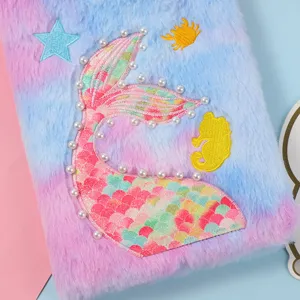 Close-up detail of the cute mermaid tail plush notebook cover featuring sequins and pearls.