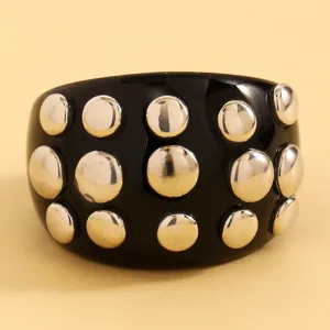 Black resin punk rivet cuff bracelet with silver metal studs, stylish bold rock fashion jewelry.