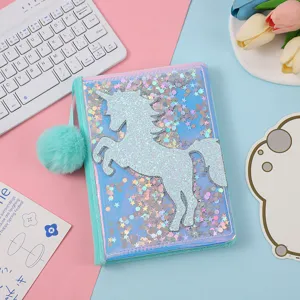 Glitter unicorn A5 notebook detail view, cute sequin shaker diary with fluffy pom-pom pendant.