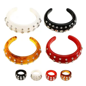 Chunky resin cuff bracelet and matching ring set with metallic rivet studs in four colors.