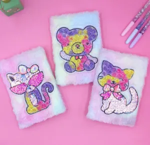 Detailed shot of cute fluffy tie-dye notebooks with shiny sequin animal patches for daily notes.