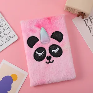 Plush notebook detail view, cute panda design with sparkly horn, soft touch texture for kids.