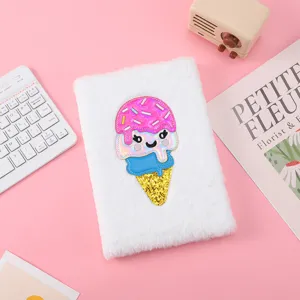 Cute fluffy notebook ice cream applique detail, soft plush cover journal close up shot.
