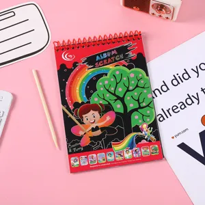 Kids scratch art book with colorful rainbow magic drawing paper and wooden stylus tool.