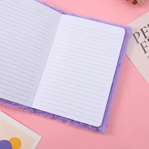 Purple plush notebook detail view featuring soft fuzzy cover and lined pages for writing.