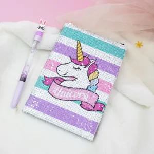 Close-up detail of a colorful sequin unicorn notebook with lovely design and shiny cover.