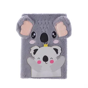 Close-up detail of the fluffy grey koala plush notebook cover with cute embroidered features.