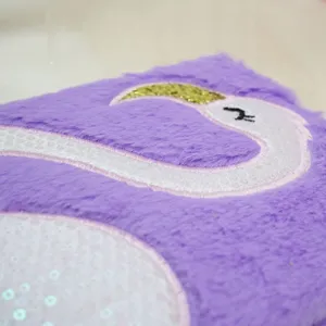 Flamingo plush notebook detail view, cute fuzzy diary cover with sparkling sequin design.