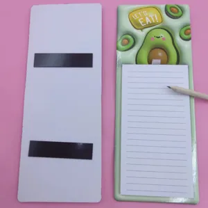Detailed view of cute avocado magnetic notepad with tear-away lined paper and pencil.