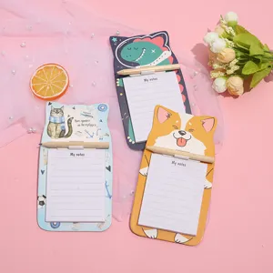 Detailed view of cute cartoon magnetic memo pads with wooden pencils, fridge notes.