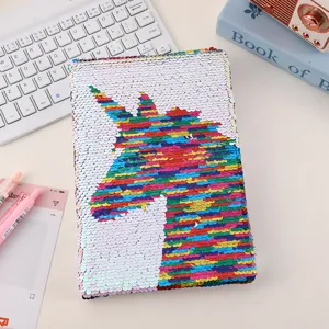 Portable DIY sequin notebook with colorful unicorn pattern for students and journal writing.