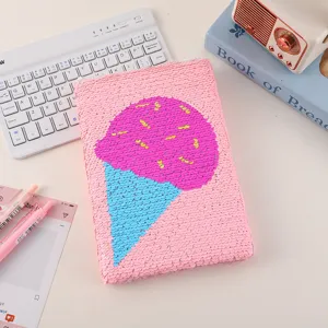 Close-up of cute magic reversible sequin notebook featuring ice cream design, perfect for daily journal.
