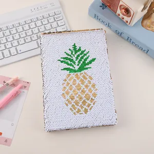 Reversible sequin notebook detail, featuring a cute pineapple pattern, perfect journal for students.