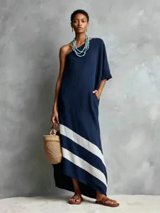 Details of a stylish one-shoulder linen dress with striking diagonal stripes for women.