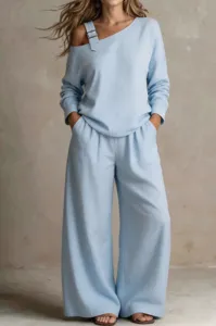 Light blue casual loose two-piece set with single shoulder buckle strap for women.